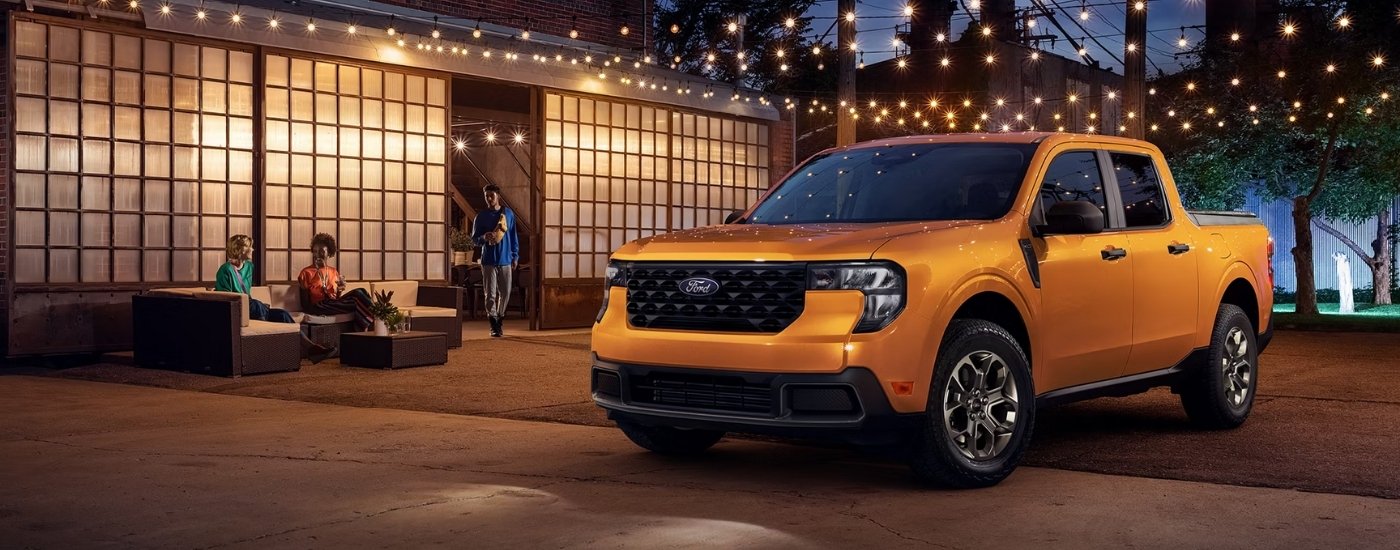 Yellow 2026 Ford Maverick XLT parked at night